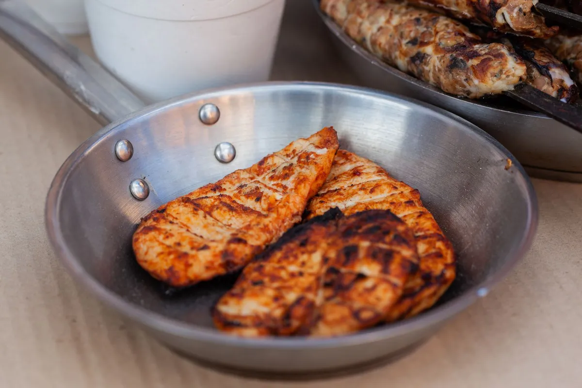 A plate of grilled chicken and eggs, high protein for few calories